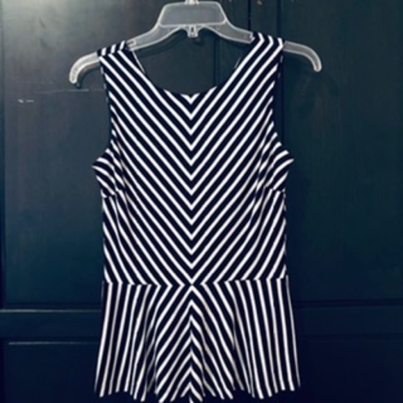 Sleeveless Peplum Top - Picture 1 of 7